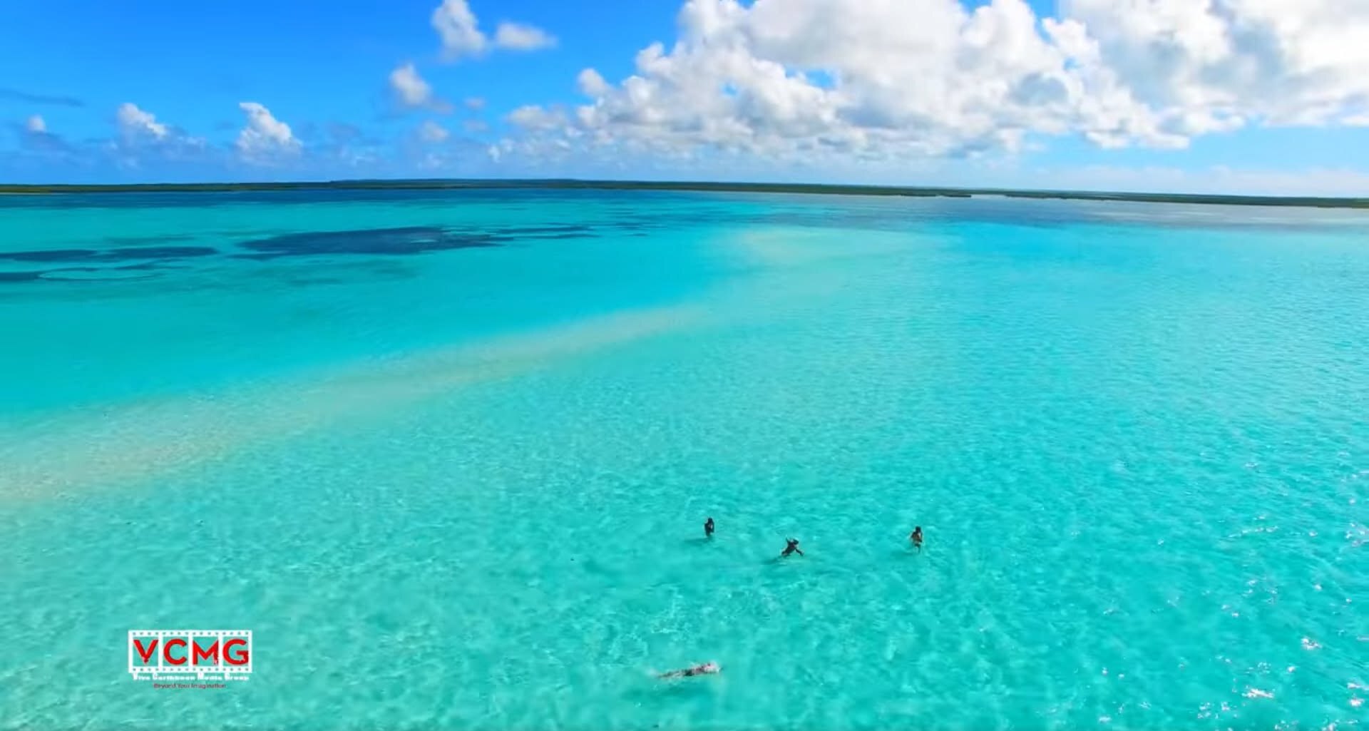 Swimmers in clear Caribbean water off Antigua