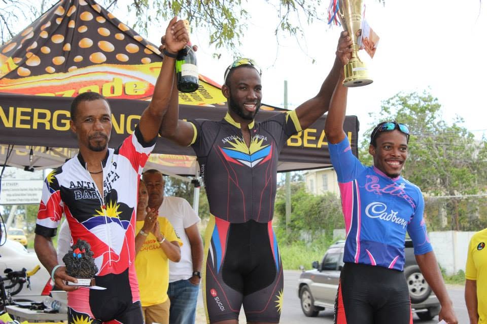 Andre Simon celebrating a cycling victory on the podium